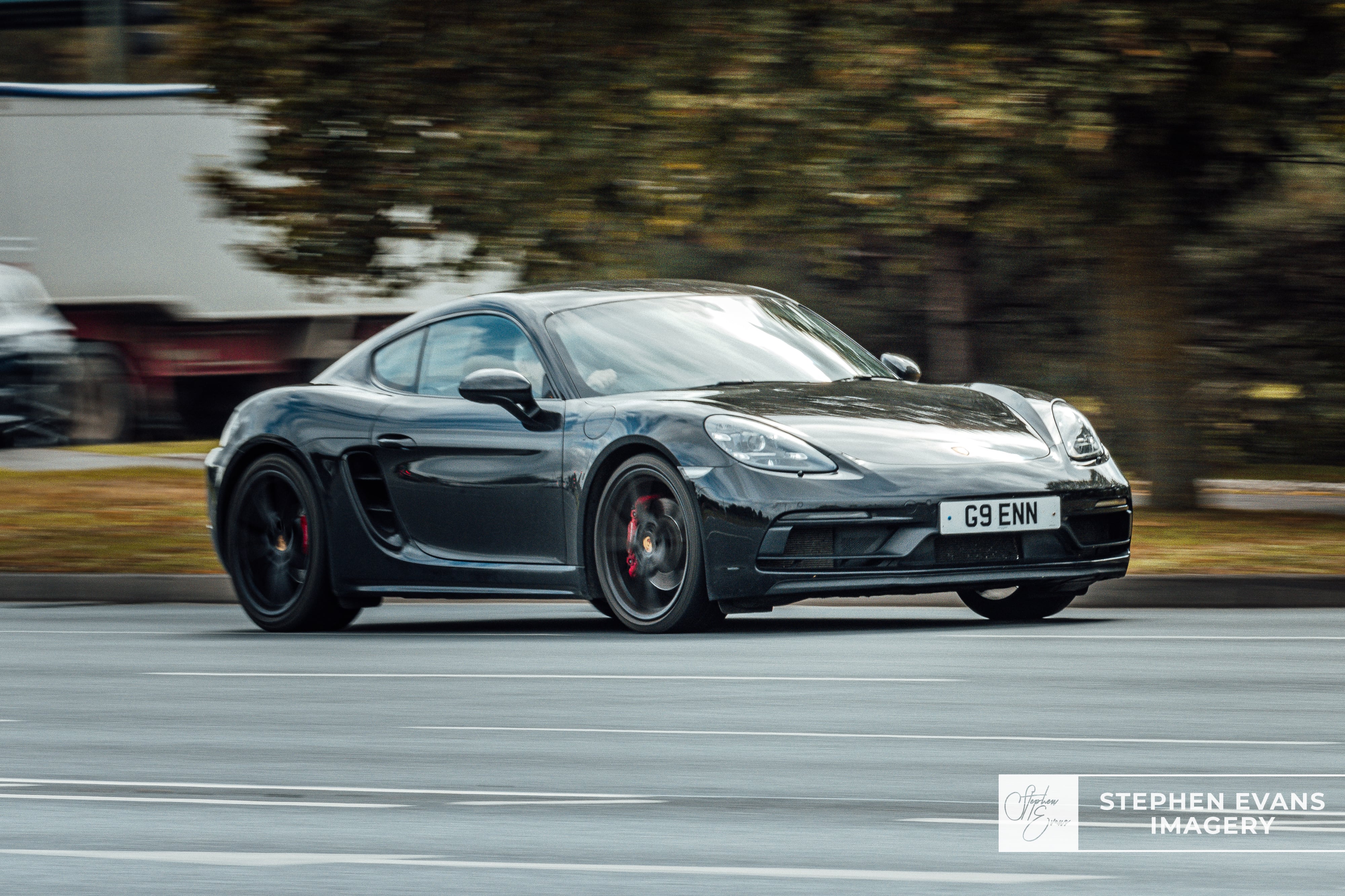 Porsche Taycan photographed with slow shutter speed, automotive motion effect